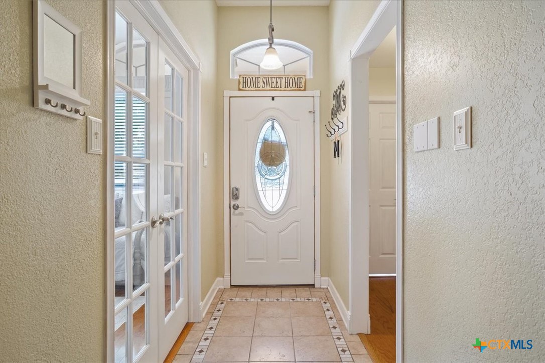 5943 Gavin Ridge Road Belton, TX 76513 - Photo 5 of 28 Hallway, front door entrance, office on left, Bedrooms 1 and 2 on right.