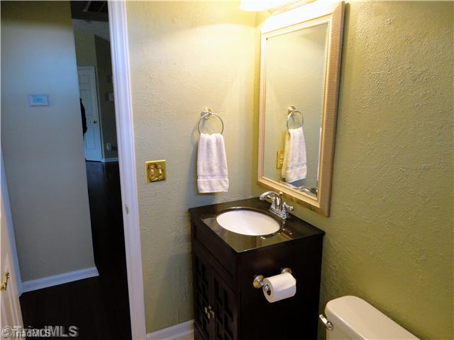 3306 Timberwolf Avenue High Point, NC 27265 - Photo 14 of 16 Bath. The hall bath is complimented by a lovely furniture style vanity w/ granite top & undermount sink.