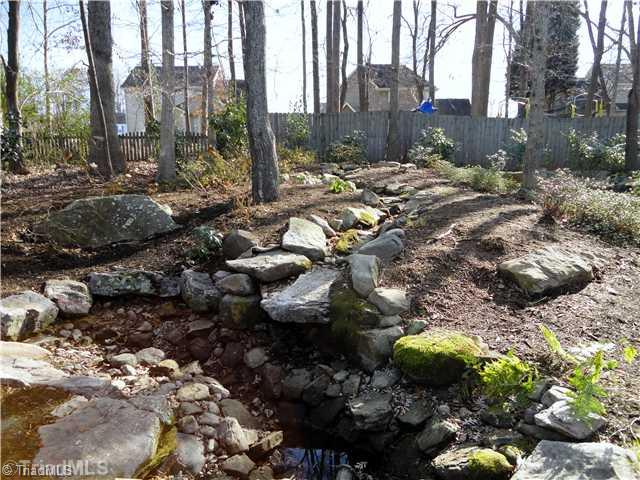 3306 Timberwolf Avenue High Point, NC 27265 - Photo 3 of 16 Landscaping. Beautiful water feature with waterfall & koi pond