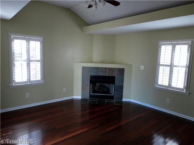 3306 Timberwolf Avenue High Point, NC 27265 - Photo 7 of 16 Den/Family/Great Room. Den provides access to the rear multi-tiered deck, corner fireplace & cove lighting @ the ceiling