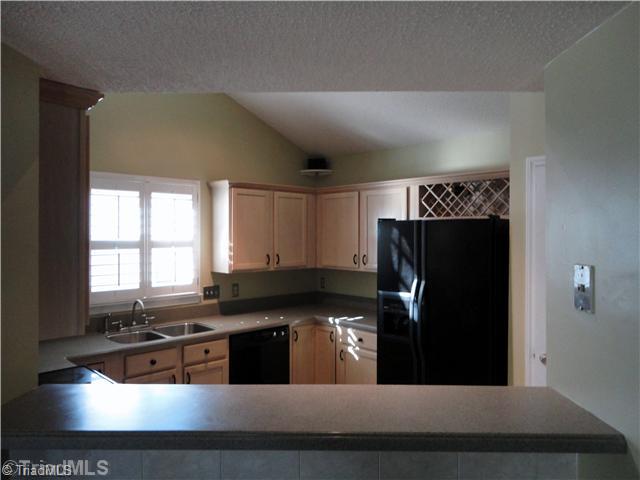 3306 Timberwolf Avenue High Point, NC 27265 - Photo 10 of 16 Kitchen. This is a view of the kitchen thru the pass-thru, breakfast area