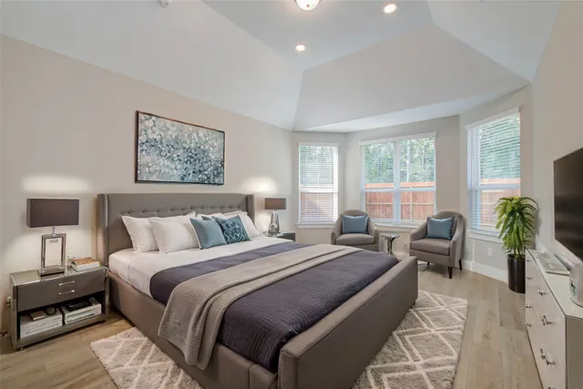 a bathroom with a double vanity sink mirror double and bathtub