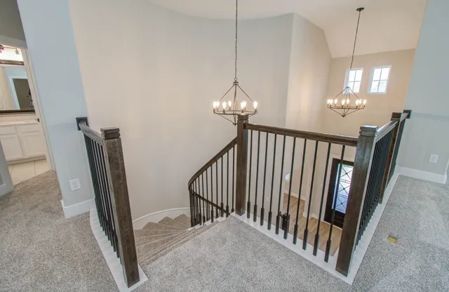 a view of a hallway with chandelier