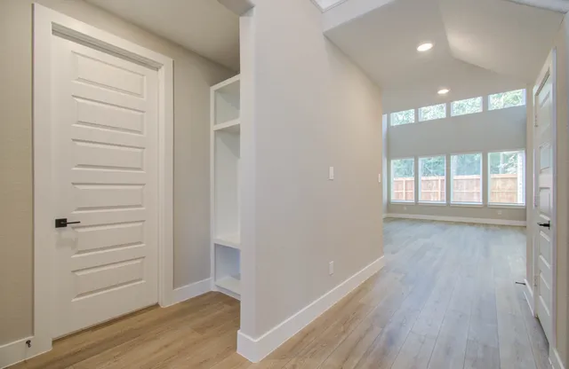 a view of walk in closet with white walls