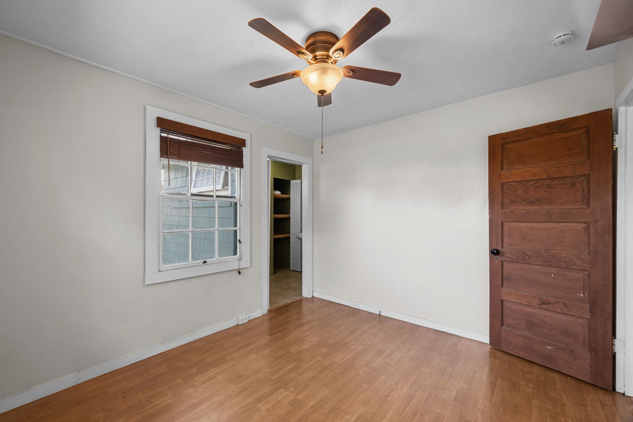 815 Kuulei Street Haiku, HI 96708 - Photo 16 of 26 an empty room with windows and ceiling fan