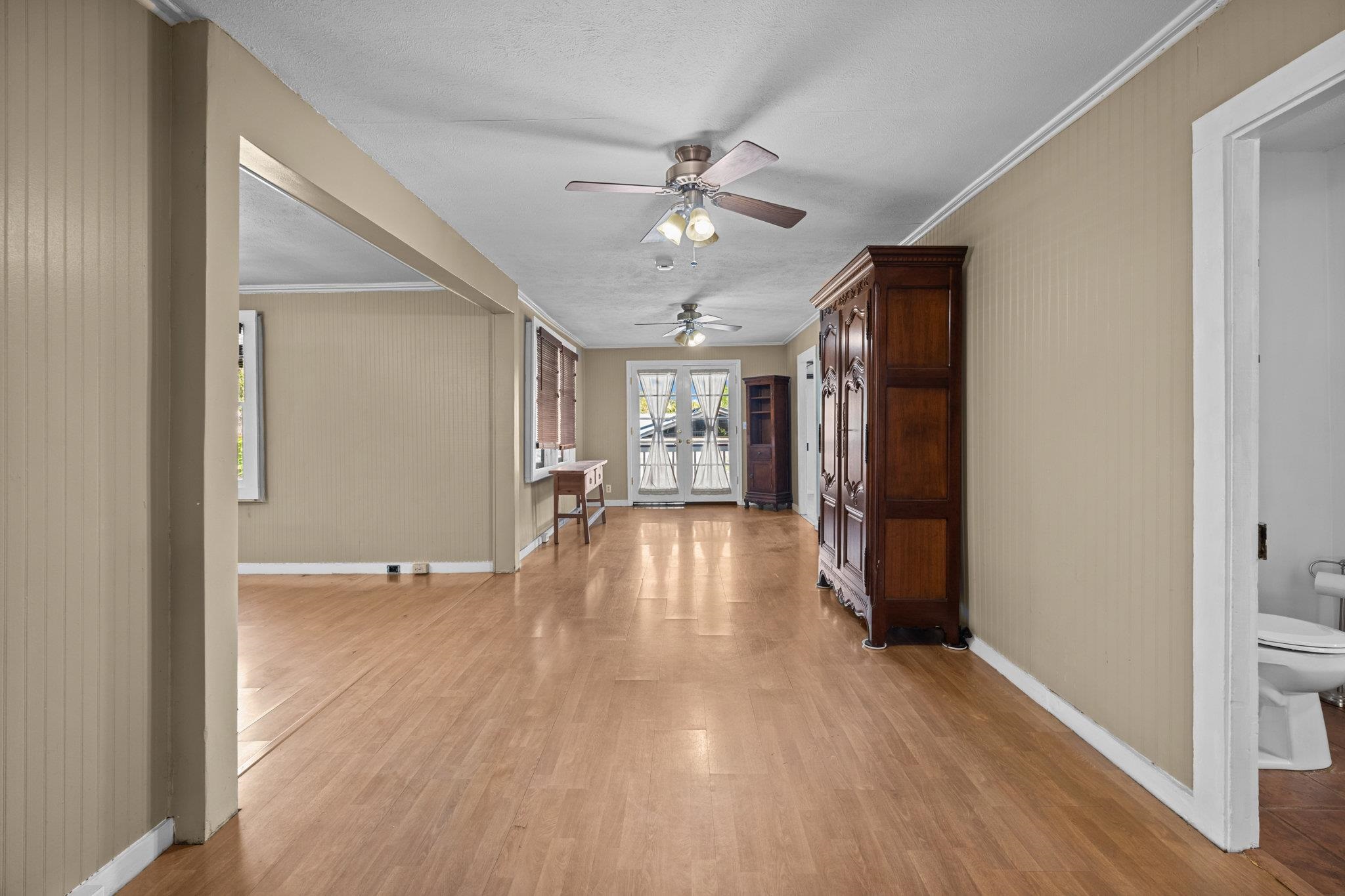 815 Kuulei Street Haiku, HI 96708 - Photo 6 of 26 a view of empty room with wooden floor