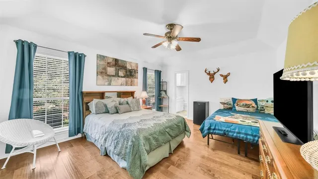 a bedroom with two beds and a table