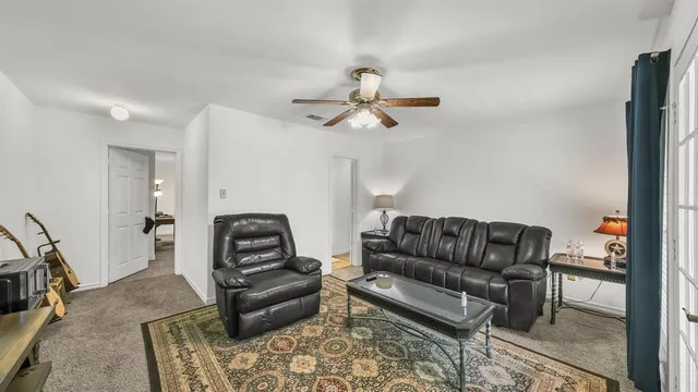 a living room with furniture and a couch