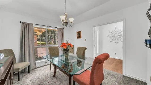 a dining room with furniture and window