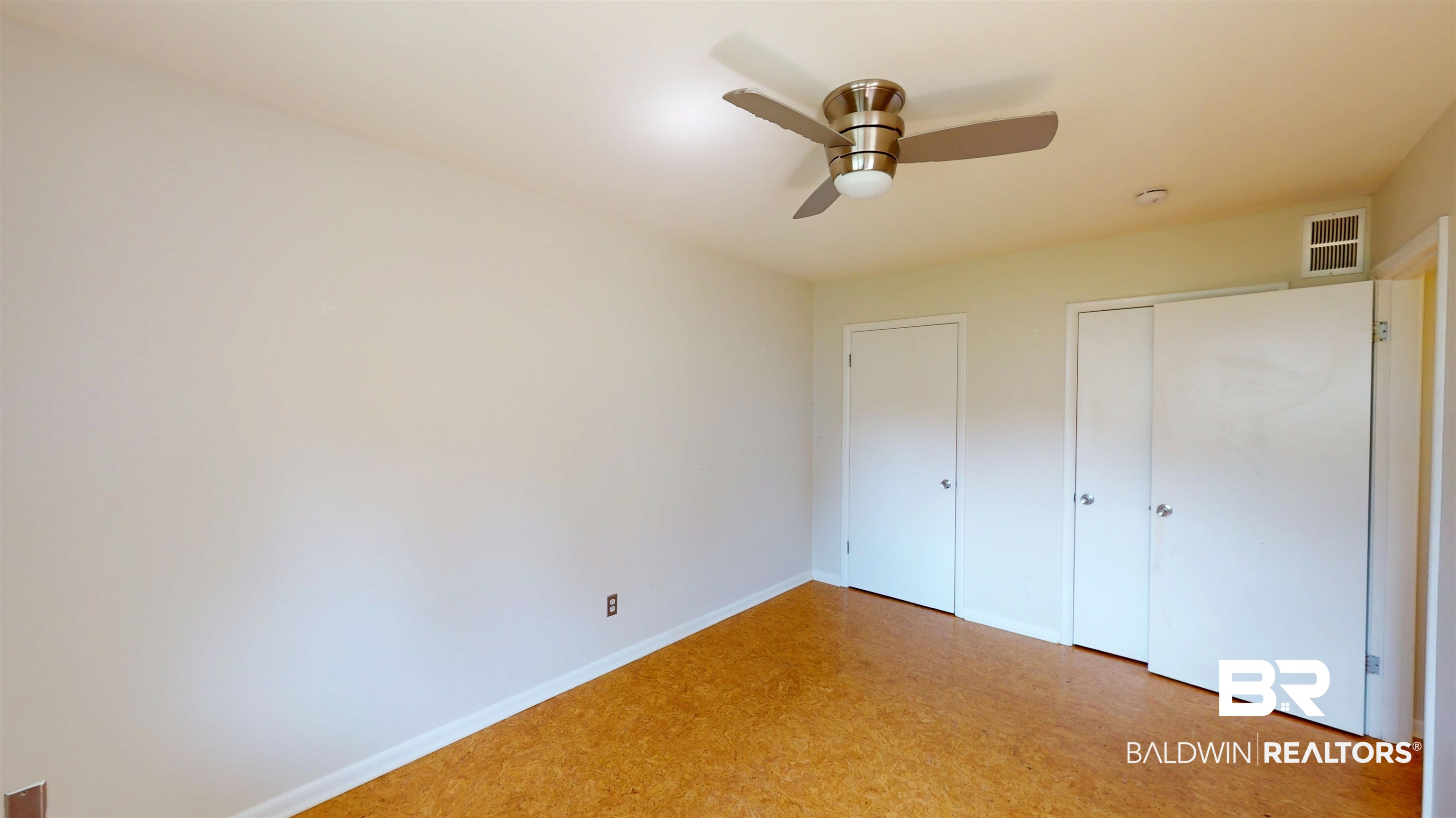 15 Spring Bank Road Mobile, AL 36608 - Photo 41 of 58 Unfurnished bedroom with ceiling fan and multiple closets