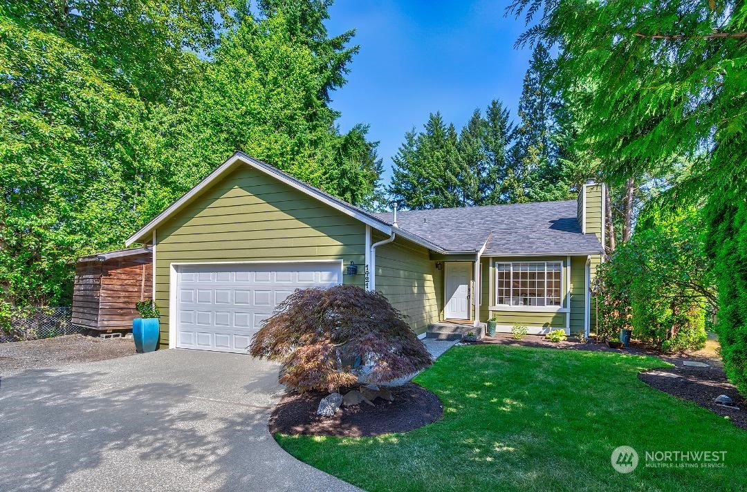 1421 231st Street Southeast Bothell, WA 98021 - Photo 1 of 21 a view of a house with a yard