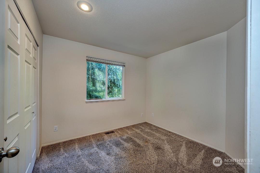 1421 231st Street Southeast Bothell, WA 98021 - Photo 16 of 21 an empty room with a window
