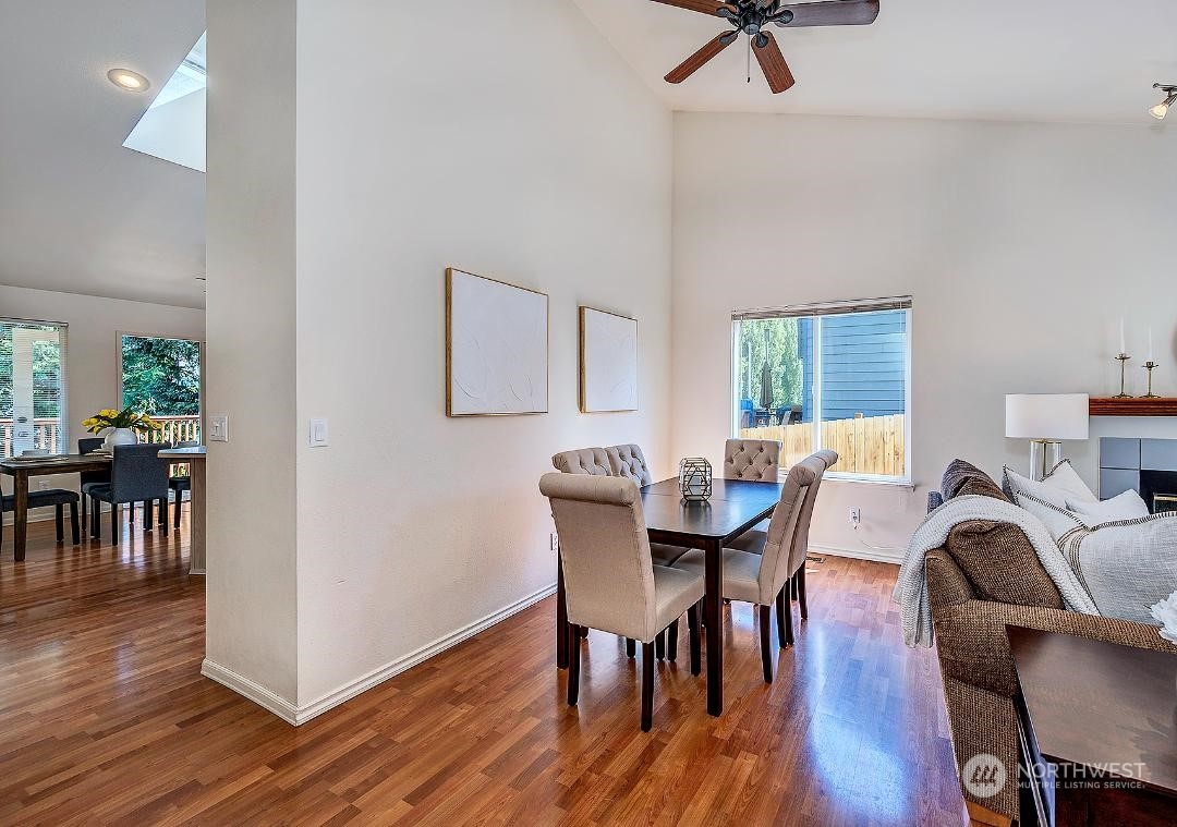 1421 231st Street Southeast Bothell, WA 98021 - Photo 5 of 21 a view of a dining room with furniture and wooden floor