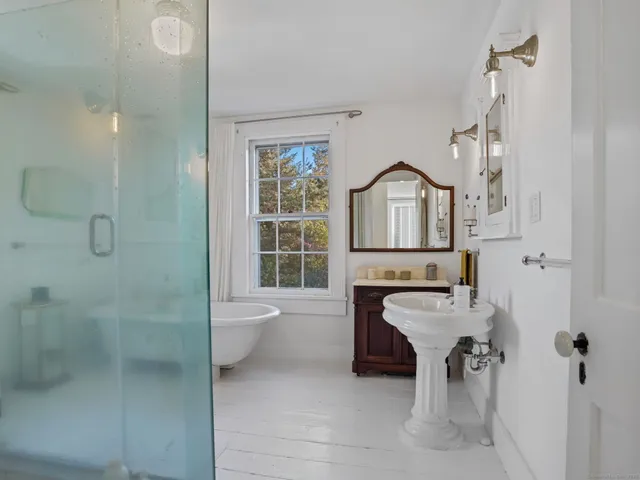 a living room with furniture a rug and a window