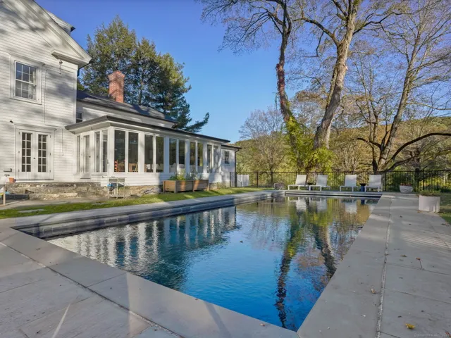 a view of swimming pool with a lake view