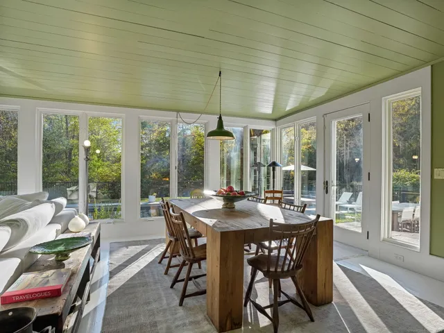 a view of a dining room with furniture window and outside view