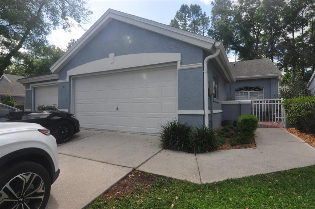 8006 Southwest 115th Loop Ocala, FL 34481 - Photo 1 of 1 a view of a house with a backyard and plants