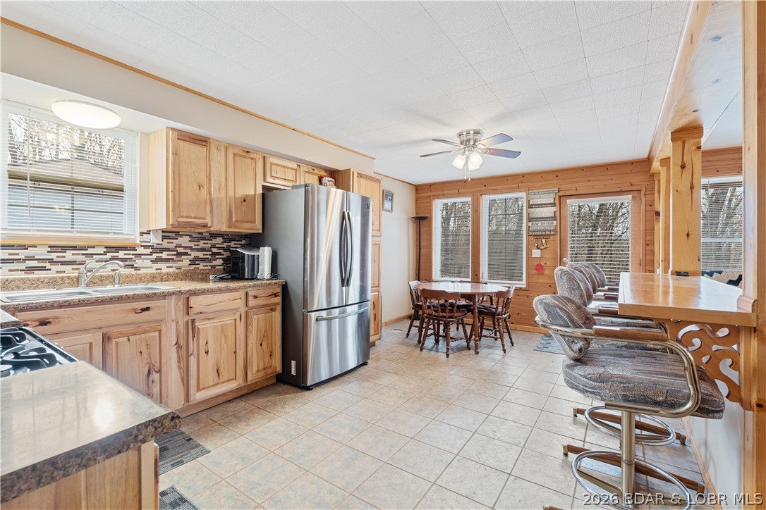 31048 Broken Circle Road Stover, MO 65078 - Photo 13 of 59 Tiled backsplash enhances the rustic style kitchen