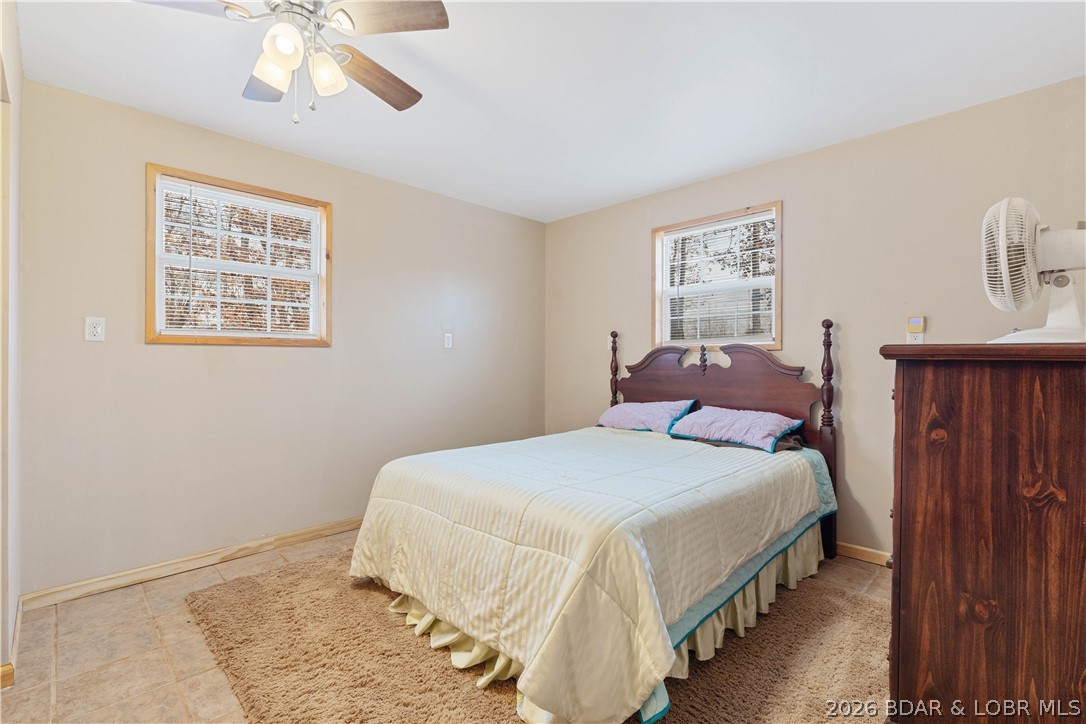 31048 Broken Circle Road Stover, MO 65078 - Photo 17 of 59 Lower/main level primary bedroom with standard siz
