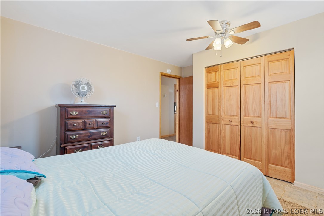 31048 Broken Circle Road Stover, MO 65078 - Photo 18 of 59 Ceiling fan & oak closet doors in lower/main level