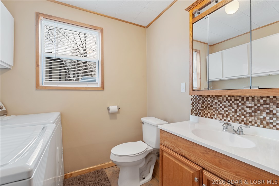 31048 Broken Circle Road Stover, MO 65078 - Photo 21 of 59 Main level/lower level 1/2 bath combined with full