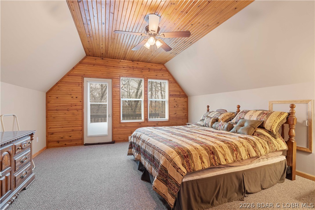 31048 Broken Circle Road Stover, MO 65078 - Photo 22 of 59 Upper level primary bedroom w/ vaulted ceilings, c