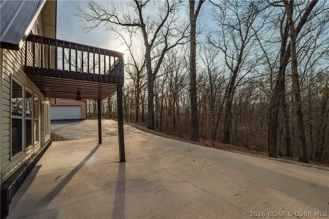 31048 Broken Circle Road Stover, MO 65078 - Photo 29 of 59 Concrete patio both covered & uncovered provides l