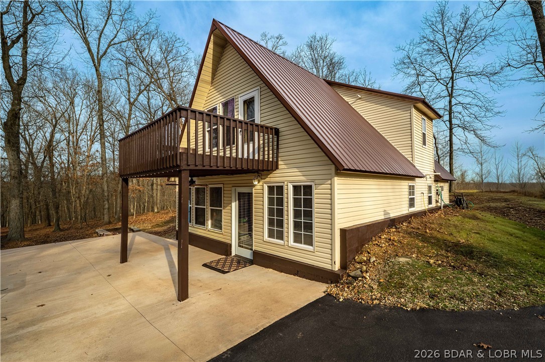 31048 Broken Circle Road Stover, MO 65078 - Photo 31 of 59 Low maintenance vinyl siding & metal roof.