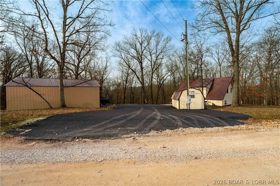 31048 Broken Circle Road Stover, MO 65078 - Photo 34 of 59 From the gravel, asphalt driveway & parking to hom