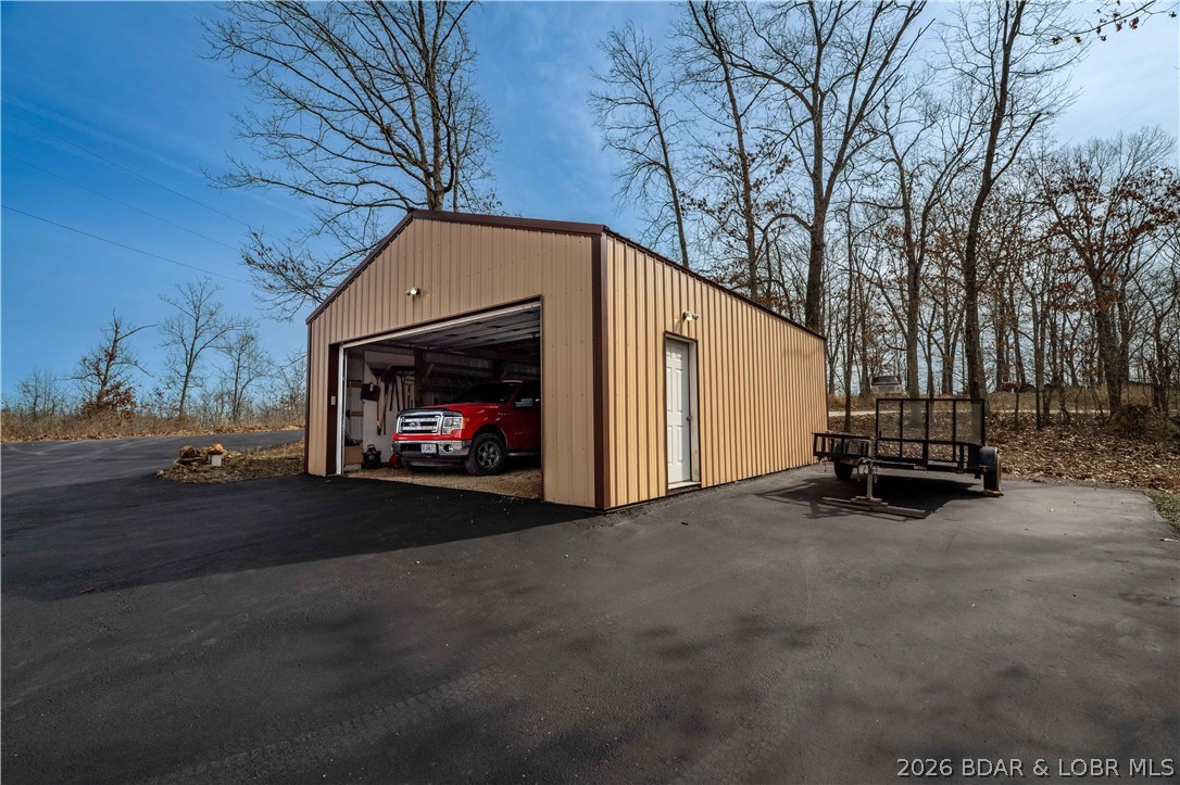 31048 Broken Circle Road Stover, MO 65078 - Photo 39 of 59 Detached shop/garage can accommodate a full sized