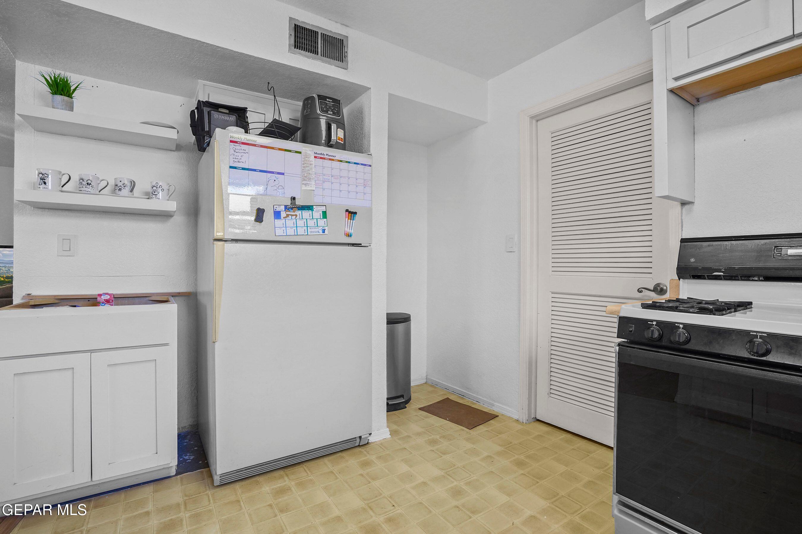 11635 Rufus Brijalba Drive El Paso, TX 79936 - Photo 14 of 32 a room with storage and utility