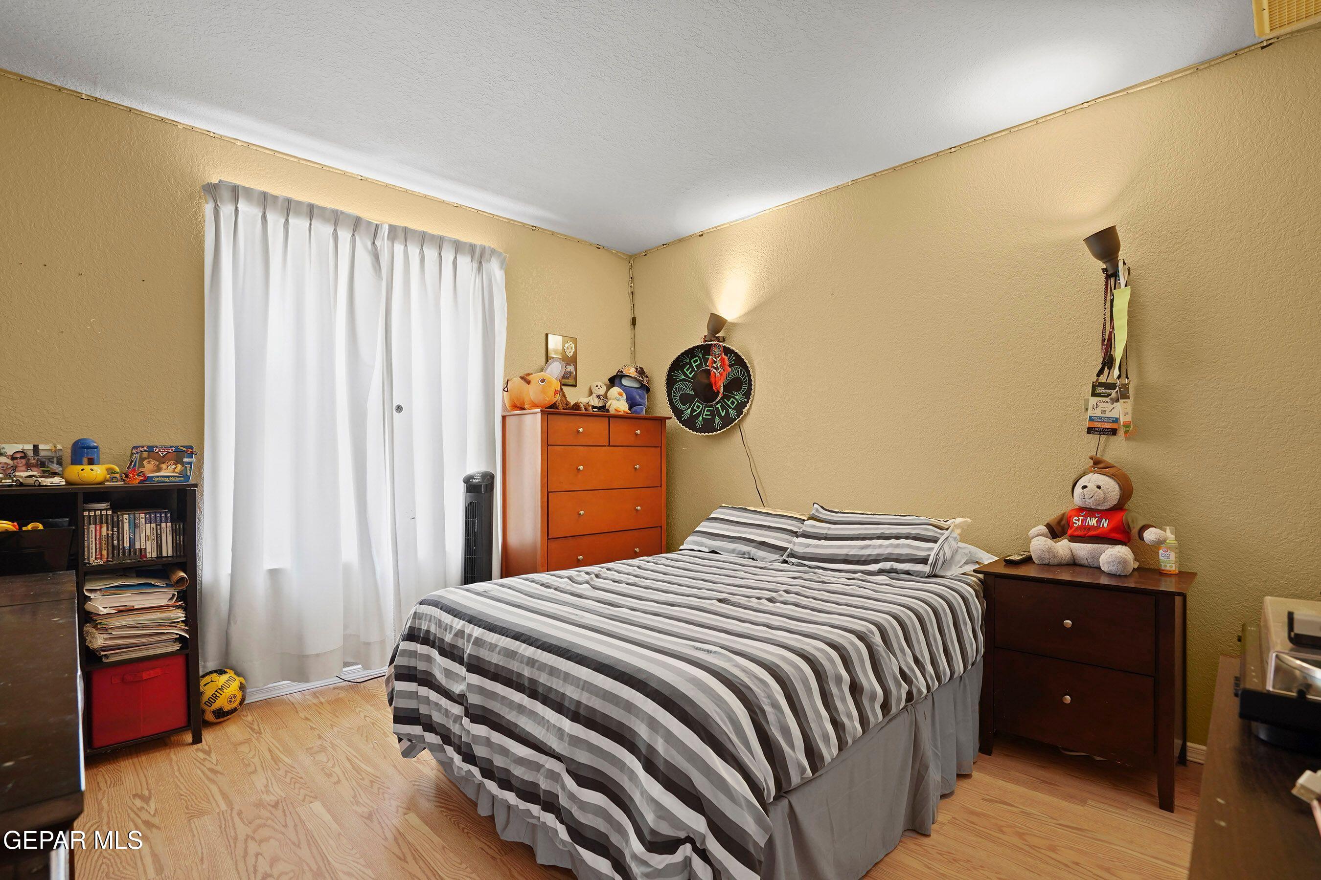 11635 Rufus Brijalba Drive El Paso, TX 79936 - Photo 26 of 32 a bedroom with a bed and a closet