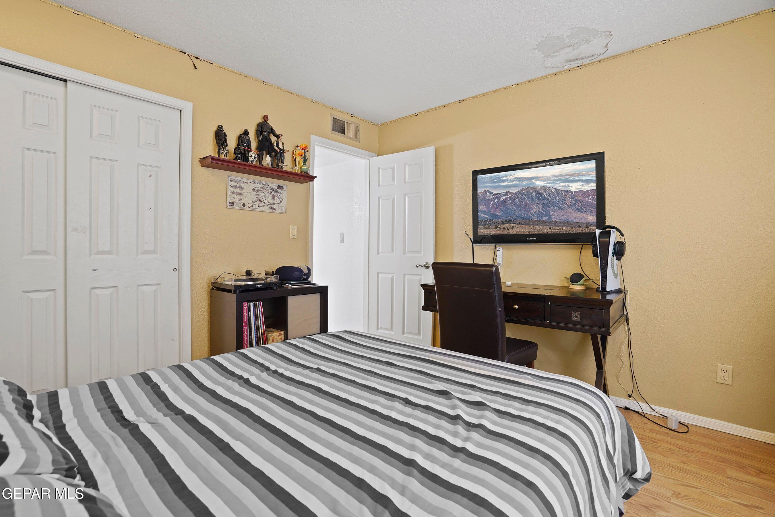 11635 Rufus Brijalba Drive El Paso, TX 79936 - Photo 27 of 32 a bed room with a bed and a television