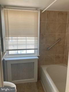 1120 44th Place Southeast Washington, DC 20019 - Photo 16 of 31 a bathroom with a bathtub and shower