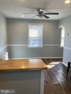 a view of kitchen and empty room