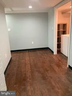 a view of a room with a refrigerator