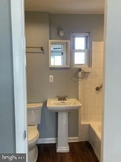 a bathroom with a sink toilet and bathtub