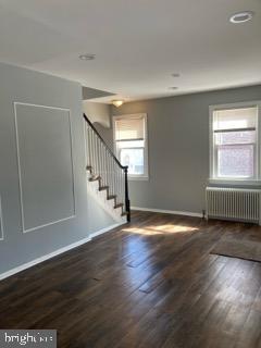 1120 44th Place Southeast Washington, DC 20019 - Photo 5 of 31 a view of an empty room with wooden floor and a window