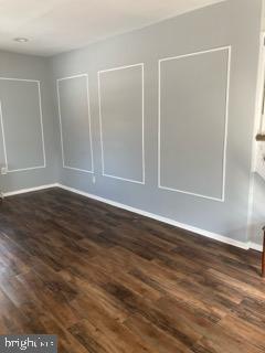 1120 44th Place Southeast Washington, DC 20019 - Photo 6 of 31 an empty room with wooden floor and windows