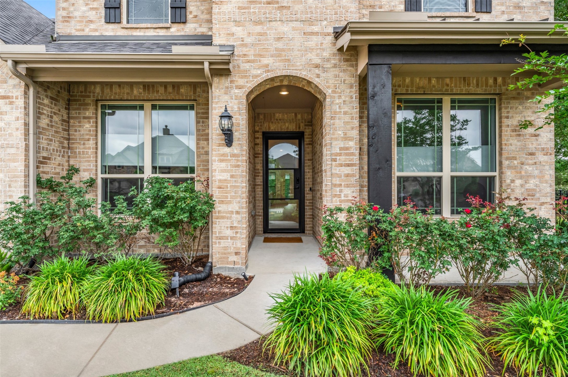 1053 Bat Hawk Court Conroe, TX 77385 - Photo 4 of 50 a front view of a house with garden