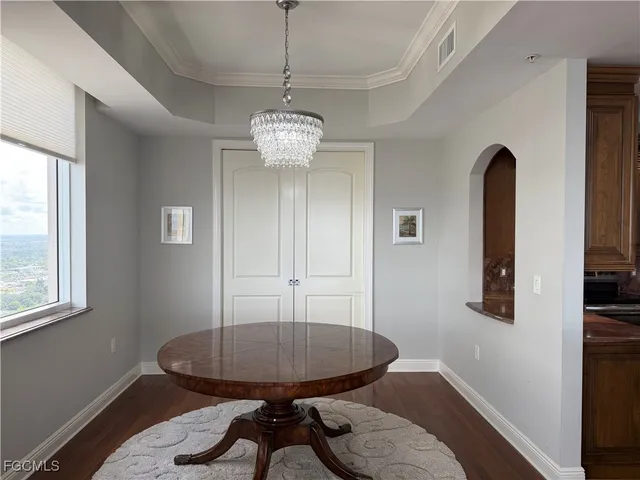 a view of a room with furniture window and wooden floor