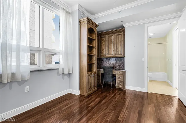 a bathroom with a granite countertop bathtub shower sink and vanity