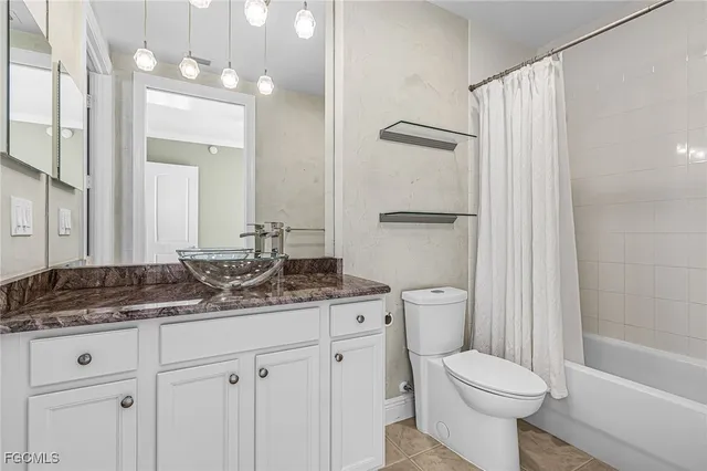 a utility room with sink dryer and washer