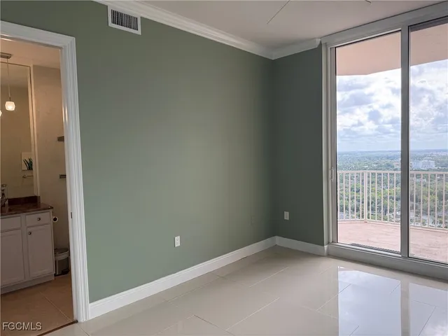 a view of an empty room with a window