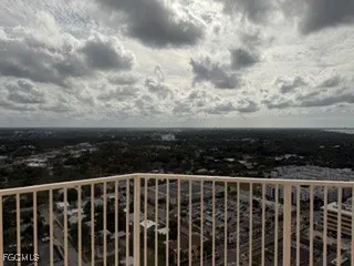 a view of a balcony with wooden fence