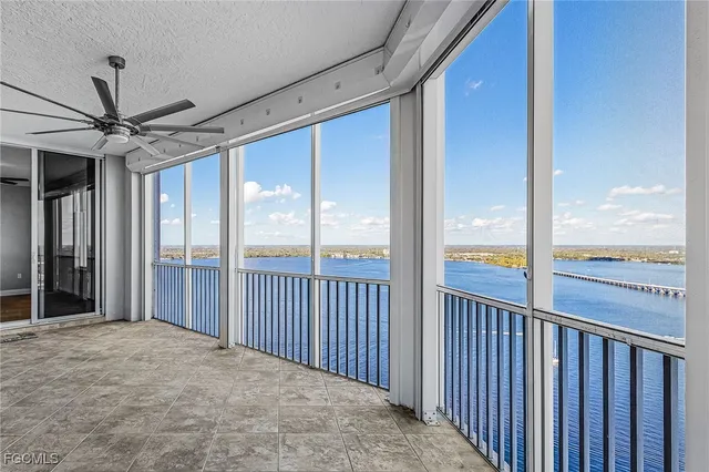 a view of a livingroom with hardwood floor and a ceiling fan