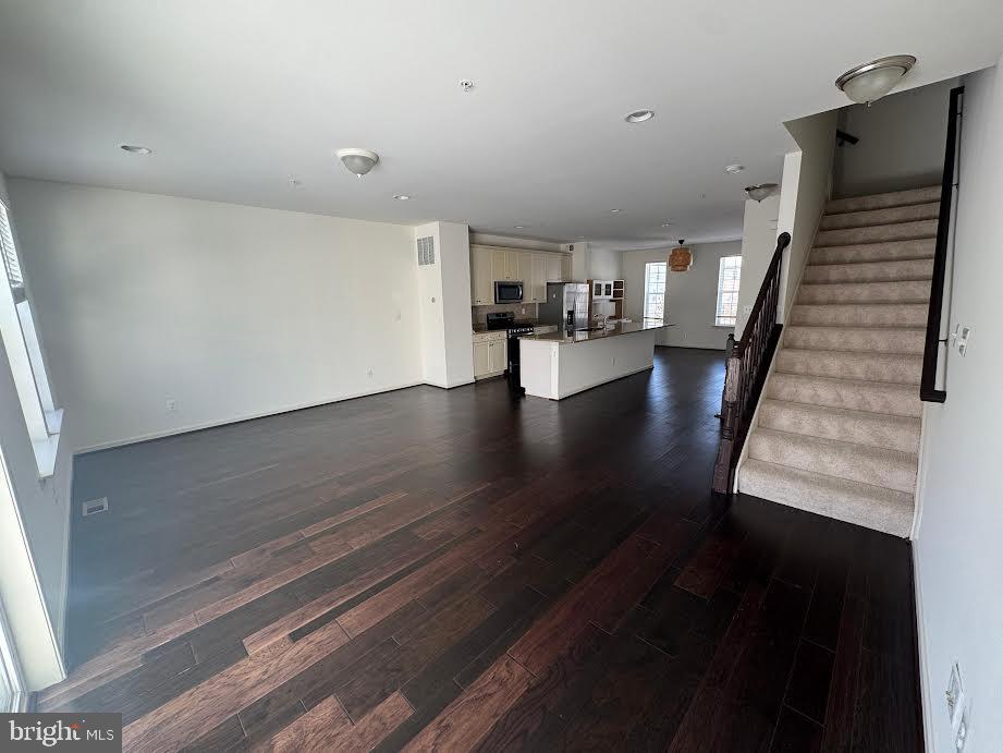7805 Cherrel Brooks Way Elkridge, MD 21075 - Photo 39 of 62 a view of a living room with wooden floor