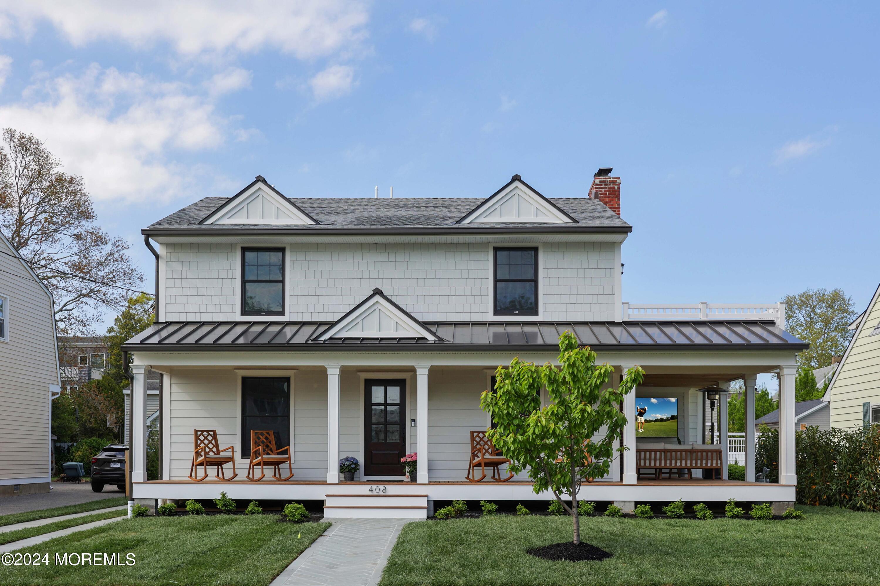 408 Central Avenue Spring Lake, NJ 07762 - Photo 1 of 46 a front view of a house with a yard