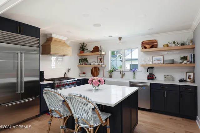 a kitchen with a dining table and chairs