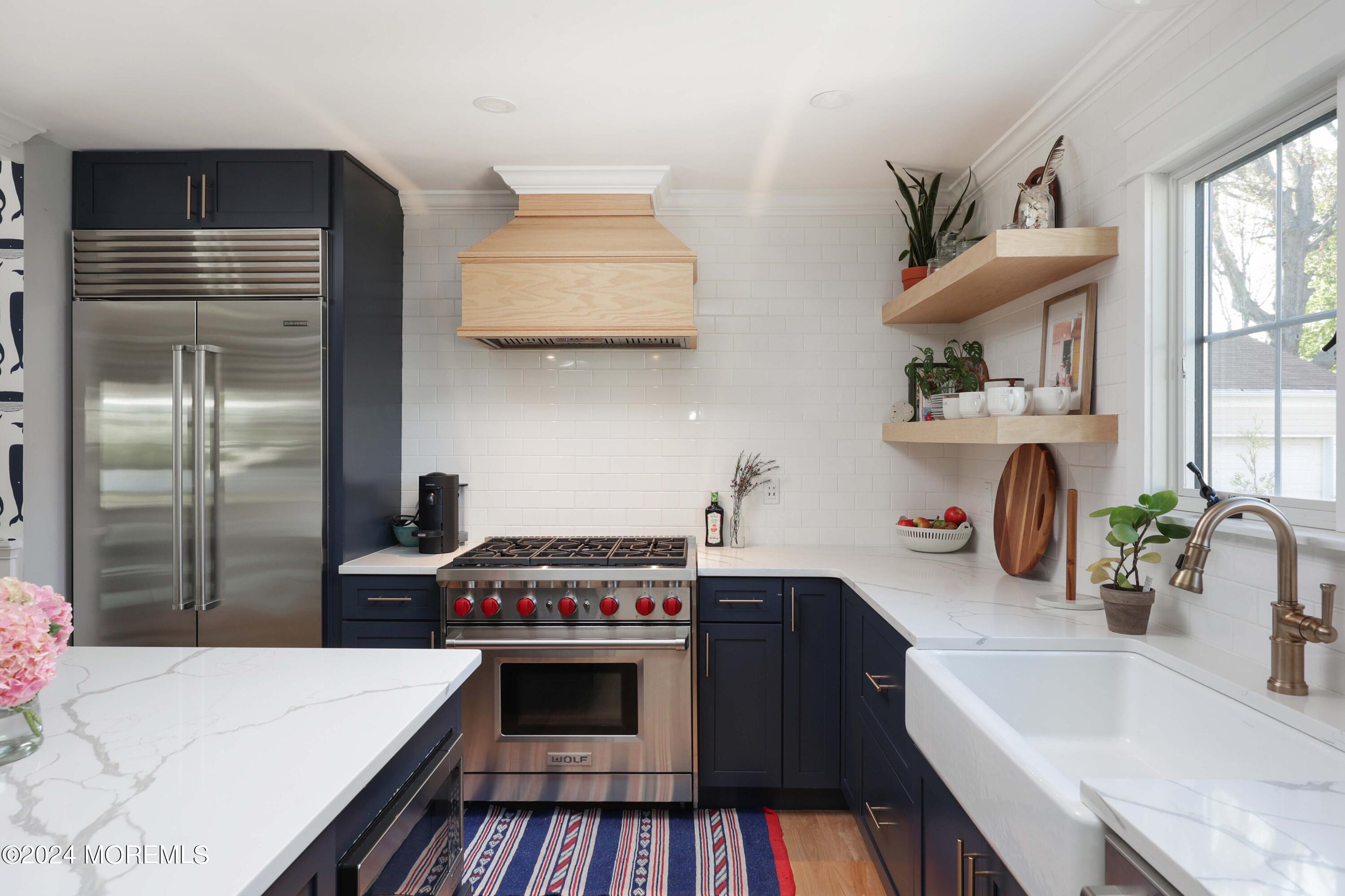 408 Central Avenue Spring Lake, NJ 07762 - Photo 14 of 46 a kitchen with stainless steel appliances a sink stove and refrigerator